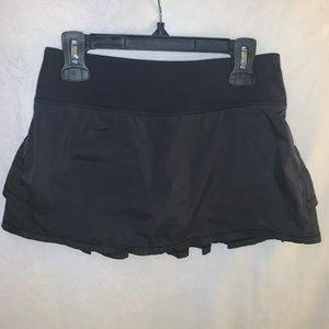 Black Ivivva skirt with ruffles on the back